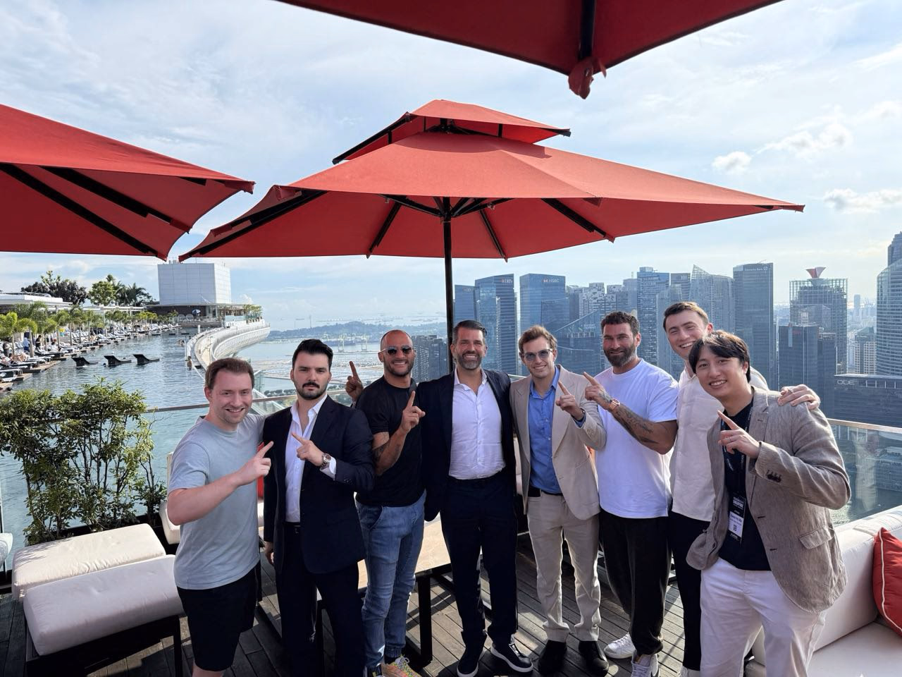 Two men in suits pointing